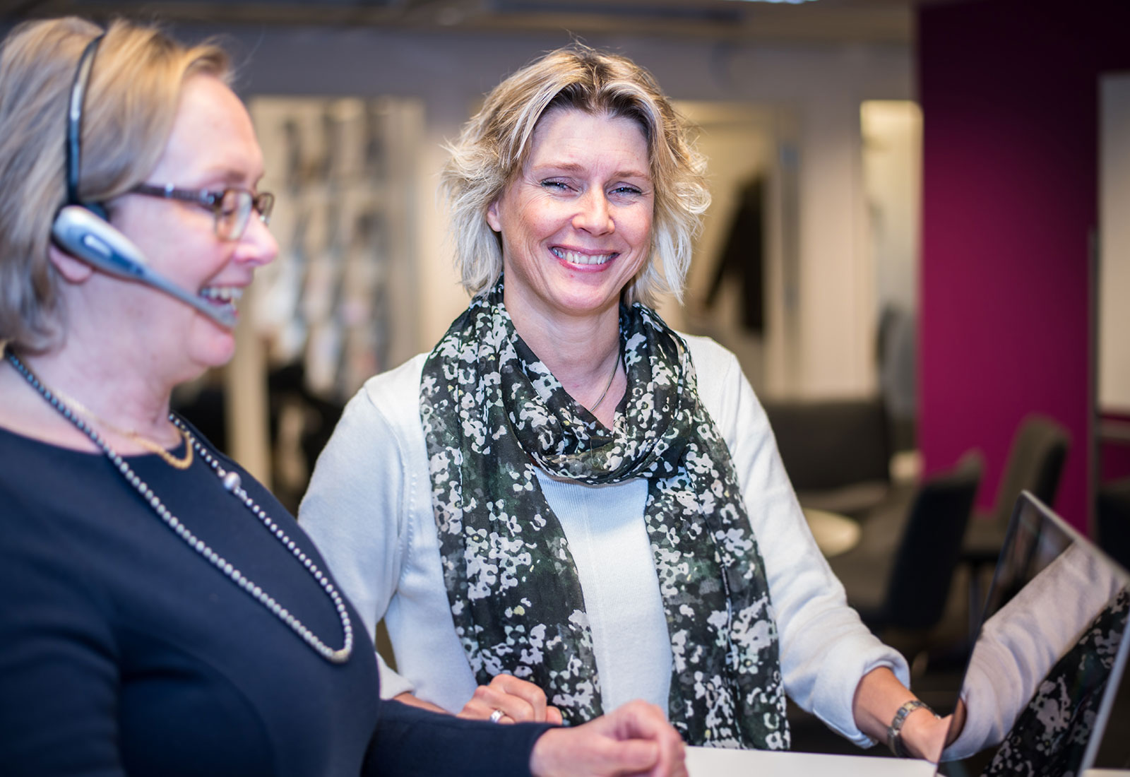 Female librarian smiling